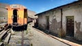 The abandoned railway wagons with damaged warehouse buildings