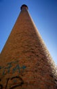 Abandoned red brick industrial chimney Royalty Free Stock Photo