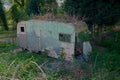 Abandoned retro caravan. Nature takes over Royalty Free Stock Photo