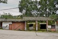 Abandoned roadside tile-roofed buildings of 1960s in cloudy afternoon