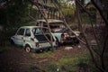 Abandoned and robbed old cars standing in the open air