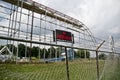 Abandoned Roller Coaster in Overgrown Amusement Park, No Trespassing Warning