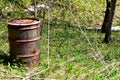 Abandoned Rotten and Rusty 55 Gallon Drum in Nature