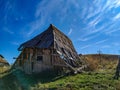 Abandoned ruin old traditional style architecture wooden cabin hut in the isolated mountain village surrounded by beautiful nature Royalty Free Stock Photo