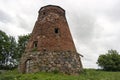 Abandoned ruin of old windmill tower near the city. Royalty Free Stock Photo