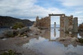 Abandoned Ruin with Woman in Doorway at Bay of Firopotamos in Mi Royalty Free Stock Photo