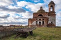 Abandoned ruined Church in the countryside nearby is a horse cart, Sunny summer day sky