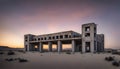 ruined concrete industrial brutalist building in desert landscape at sunset