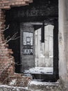 Abandoned and ruined industrial building with holes and bricks