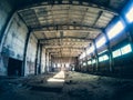 Abandoned ruined industrial factory building, corridor view with perspective, ruins and demolition concept Royalty Free Stock Photo