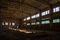 Abandoned ruined industrial factory building, corridor view with perspective, ruins and demolition concept Royalty Free Stock Photo