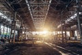 Abandoned ruined industrial factory building, corridor view with perspective and sunlight, ruins and demolition concept Royalty Free Stock Photo