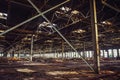 Abandoned ruined industrial warehouse or factory building inside, corridor view with perspective, ruins and demolition concept Royalty Free Stock Photo