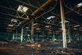 Abandoned ruined industrial warehouse or factory building inside, corridor view with perspective, ruins and demolition concept Royalty Free Stock Photo