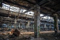 Abandoned ruined industrial warehouse or factory building inside, corridor view with perspective, ruins and demolition concept Royalty Free Stock Photo