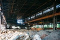 Abandoned ruined large industrial building with garbage waiting for demolition Royalty Free Stock Photo