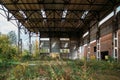 Abandoned ruined large industrial hall with garbage waiting for demolition Royalty Free Stock Photo