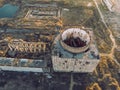 Abandoned and ruined Nuclear Power Plant in Shelkino, Crimea. Industrial construction with round tower of atomic reactor