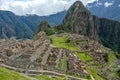 Abandoned ruins of Machu Picchu Incan citadel, the maze of terraces and walls rising out of the thick undergrowth, Peru Royalty Free Stock Photo