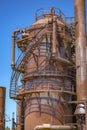 Abandoned rusted machines and storage units in a gas industry at Royalty Free Stock Photo