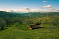 Abandoned rustic small dairy farm on the hill