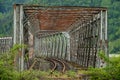 Abandoned rustic train bridge over river Royalty Free Stock Photo
