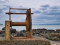 An abandoned, rusting boat winch on the Northern Ireland Antrim coast near Portstewart Royalty Free Stock Photo