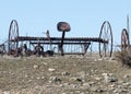 Abandoned, rusting vintage farm equipment in an open field Royalty Free Stock Photo