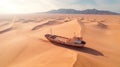 An abandoned and rusty fishing vessel lies wrecked on a dune in the desert without water.