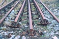 Abandoned rusty rails. Steel rails at old closed railway station. Metal materia