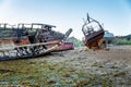 An abandoned rusty ship on a sandy beach