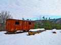 Abandoned rusty train cart in forest during winter Royalty Free Stock Photo