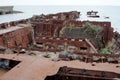 An abandoned rusty warship on the sand of the Baltic Sea. Hel. Royalty Free Stock Photo