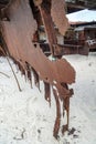 An abandoned rusty warship on the sand of the Baltic Sea. Hel. Royalty Free Stock Photo