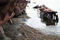 An abandoned rusty warship on the sand of the Baltic Sea. Hel. Royalty Free Stock Photo