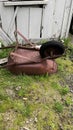 An abandoned rusty wheelbarrow. fade image. Royalty Free Stock Photo