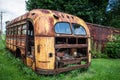 Abandoned rusty yellow school bus