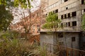 Abandoned 1970s` workshop of boiler plant in weeds