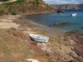 Abandoned sailing boat on a beach in Mikanos, Greece