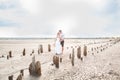 Abandoned salt production. Salt lane enclosed by dried wooden pillars on a salt lake. Adventure travel lifestyle concept