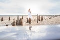 Abandoned salt production. Salt lane enclosed by dried wooden pillars on a salt lake. Adventure travel lifestyle concept.