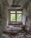 Abandoned school study with debris and broken furniture Royalty Free Stock Photo