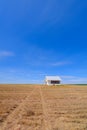 An abandoned schoolhouse in a hay field, southeastern Washington, USA