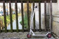 Abandoned scooter on the parapet of a bridge Royalty Free Stock Photo