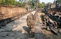 Abandoned sculptures and walls of the 12th century Preah Khan temple, Cambodia. Historical ruins in forest in Angkor Royalty Free Stock Photo