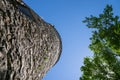 The abandoned Seppmann Mill, an old flour gristmill in Minneopa State Park. Abstract artistic angle looking up to the blue sky