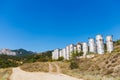 Abandoned metal cylindrical treatment facilities on the road