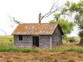 Abandoned shack in a prairie field