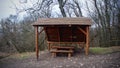 Abandoned shed with bench in forest