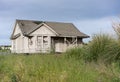 Abandoned single family home with wooden siding as fixer upper property Royalty Free Stock Photo